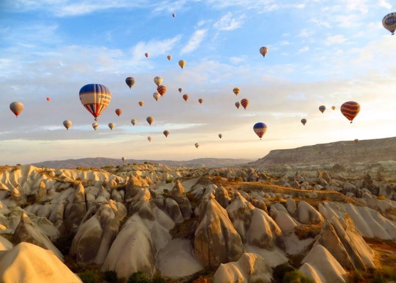 Hot air balloons flying over Cappadocia